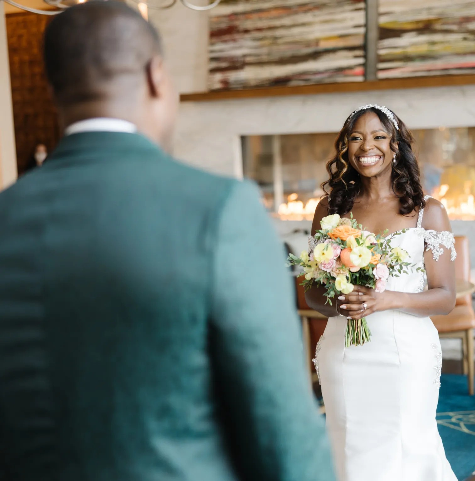 a bride smiles as she walks down the aisle