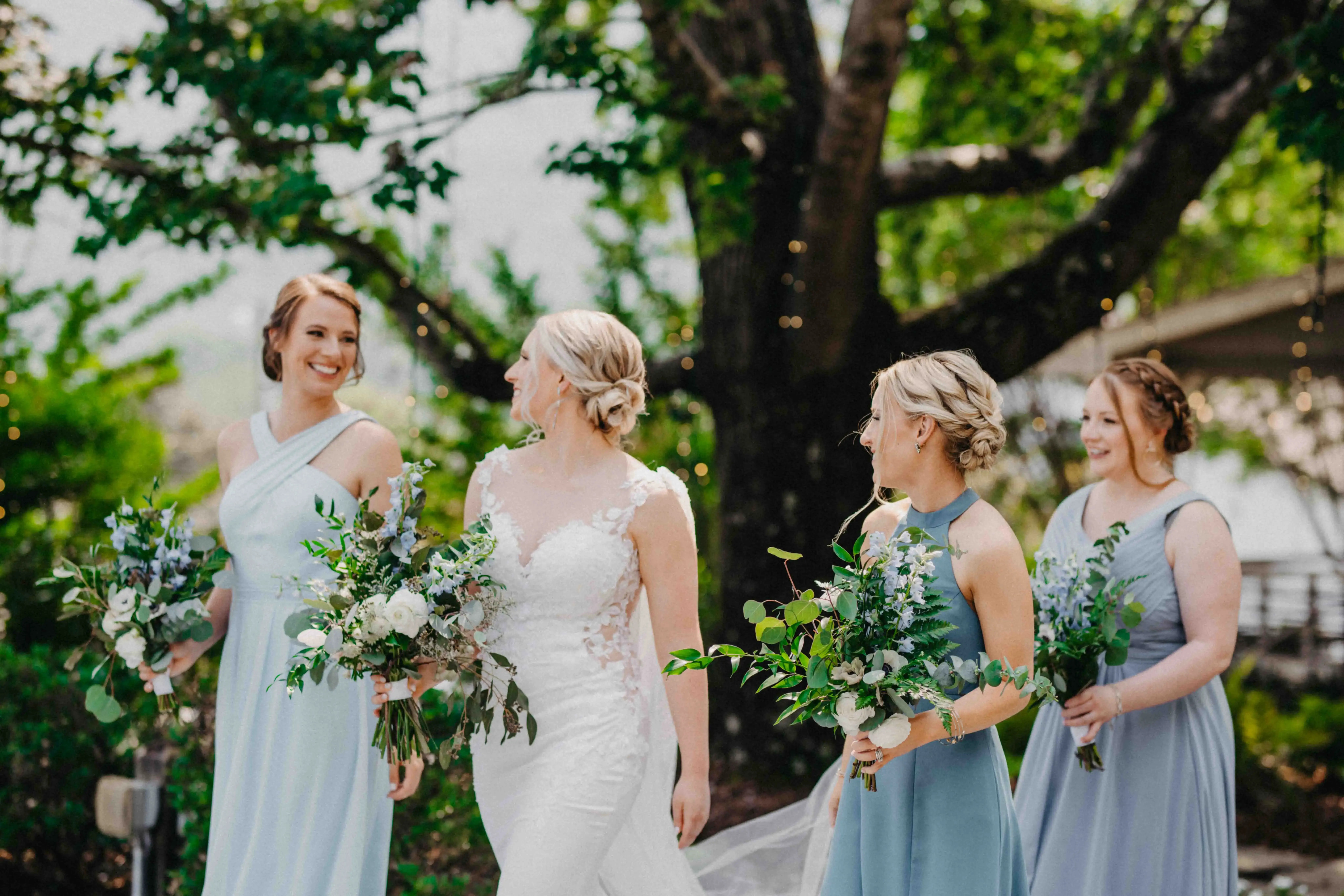 Flowers draped over wedding arch
