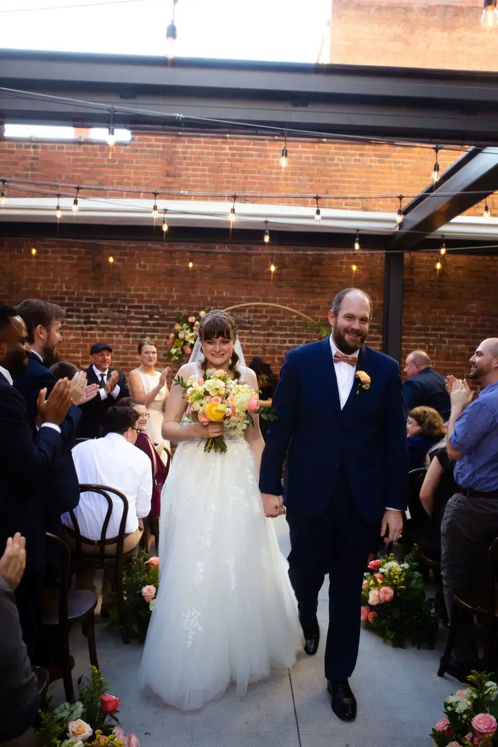 Wedding flowers on guest reception tables