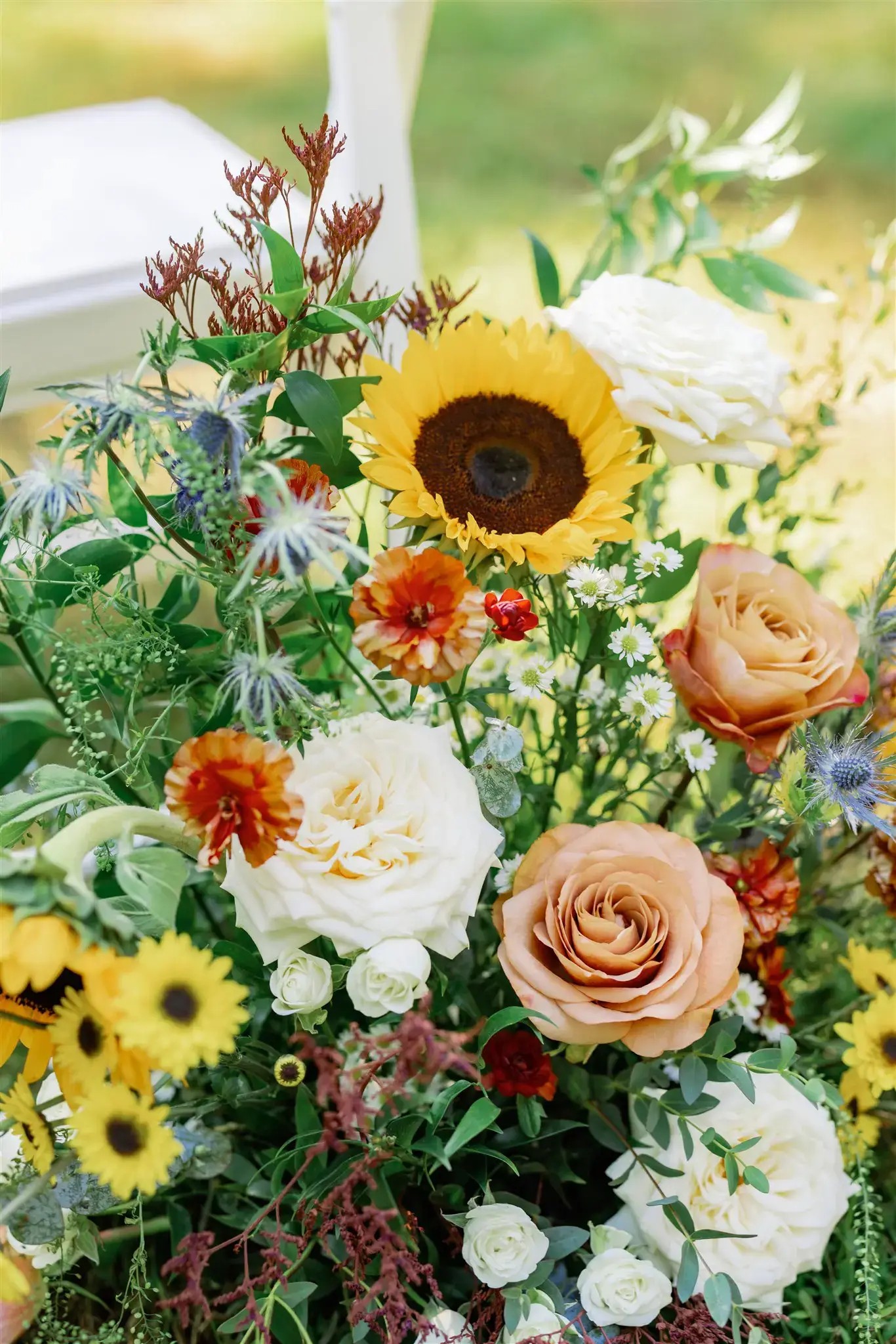 Wedding flowers on tables at garden party