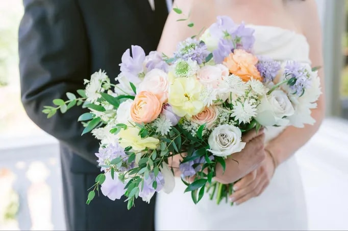 Spring flowers wedding bouquet with pastel colors and textures